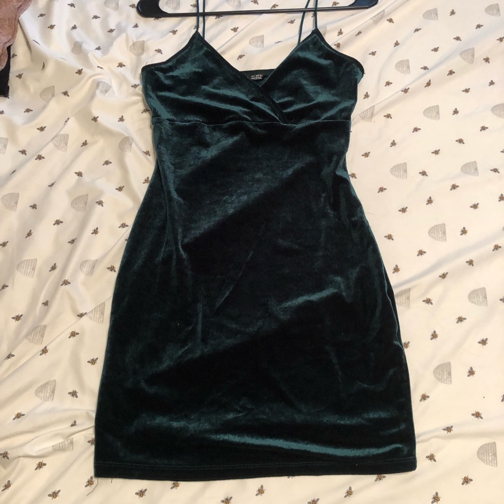 Small green velvet dress.